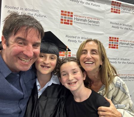 David Bryfman smiling with his two kids and wife at Jonah's graduation