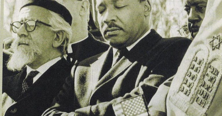 MLK and Rabbi Heschel marching together with a Sefer Torah