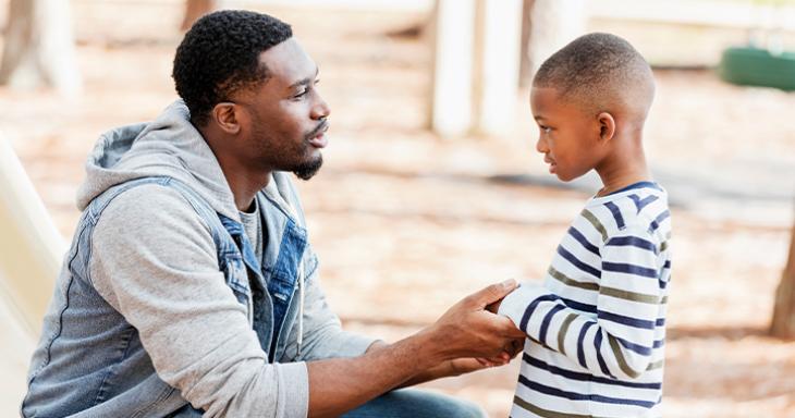 Dad talking to son