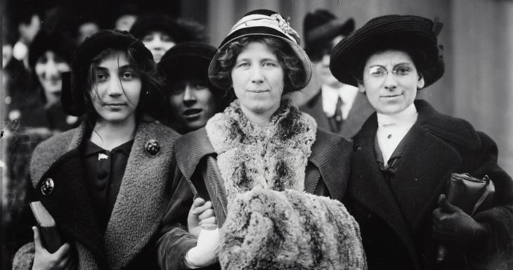 Suffragettes standing together during strike