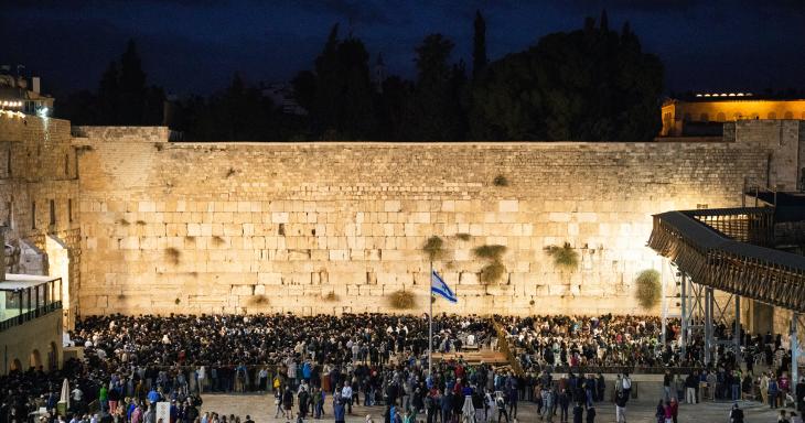 The Western wall during prayer at night 