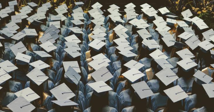 Group of people in graduation caps and gowns