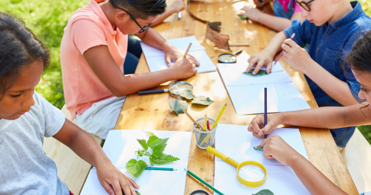 Kids at a picnic table making art