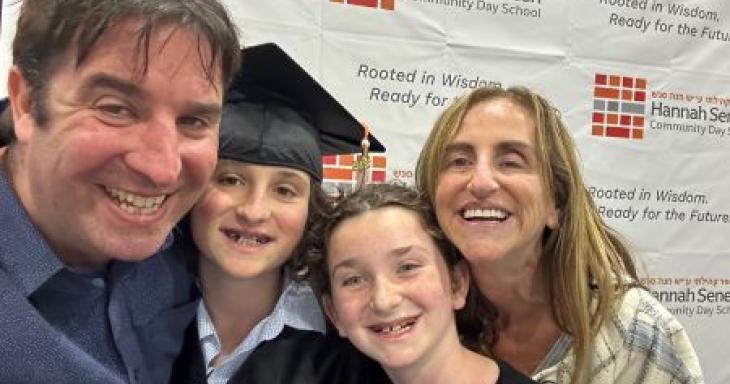 David Bryfman smiling with his two kids and wife at Jonah's graduation