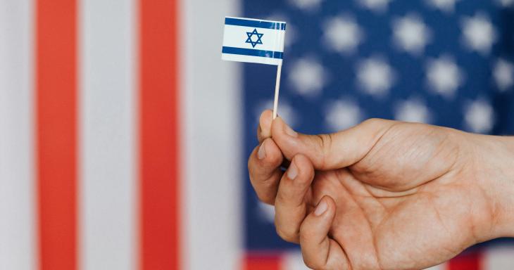 Israeli flag in front of American flag