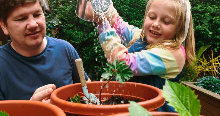 Father and daughter gardening