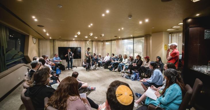 a group of people sit in a circle