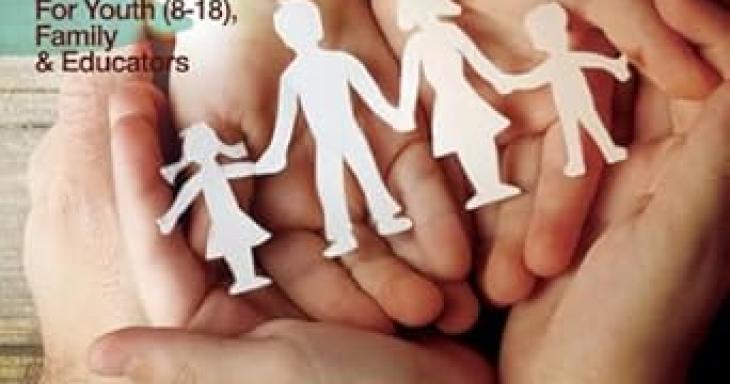 The cover of the curriculum featuring childrens hands over each others, holding a family made out of paper