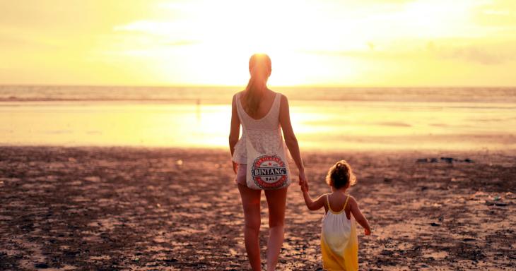 Mom and daughter holding hands