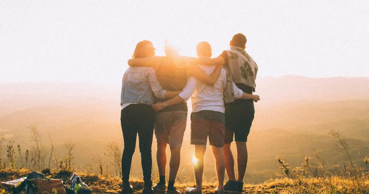 teens with arms around one another