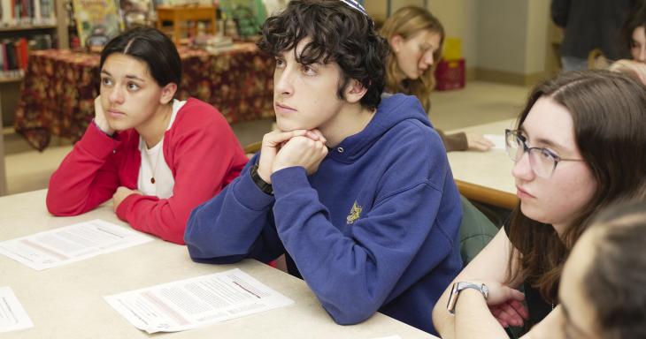 Students studying off of a source sheet.
