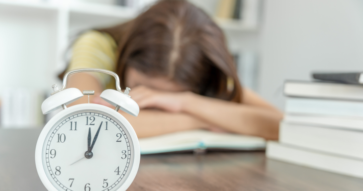 alarm clock with child in background