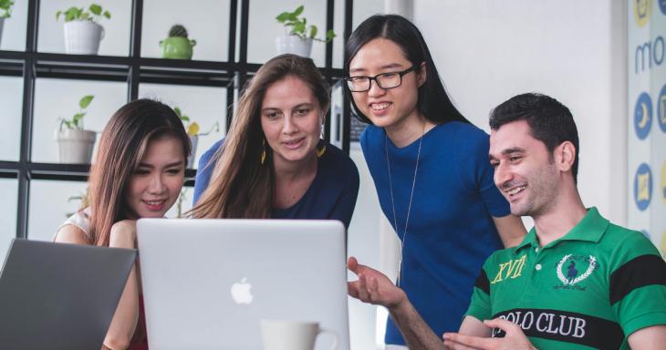 group looking at computer together