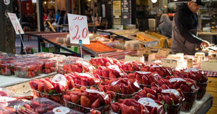 A selection of strawberries in a shuk stall. 