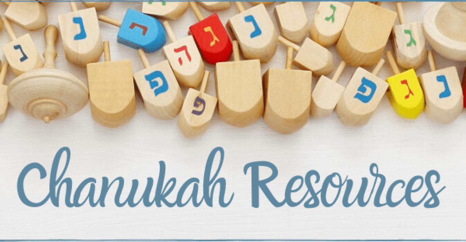 Chanukah resources written below dreidels