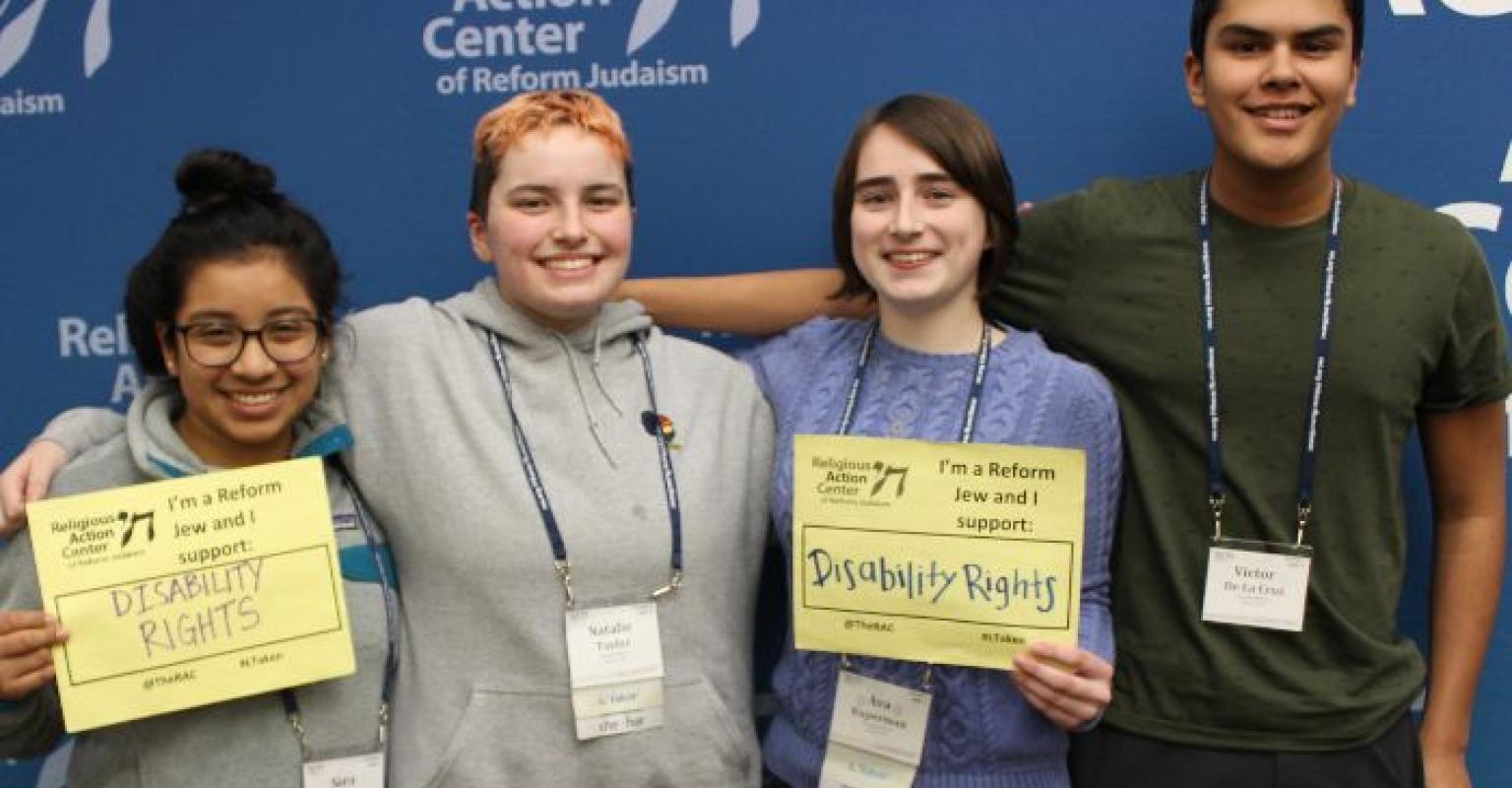 People holding "disability rights" signs