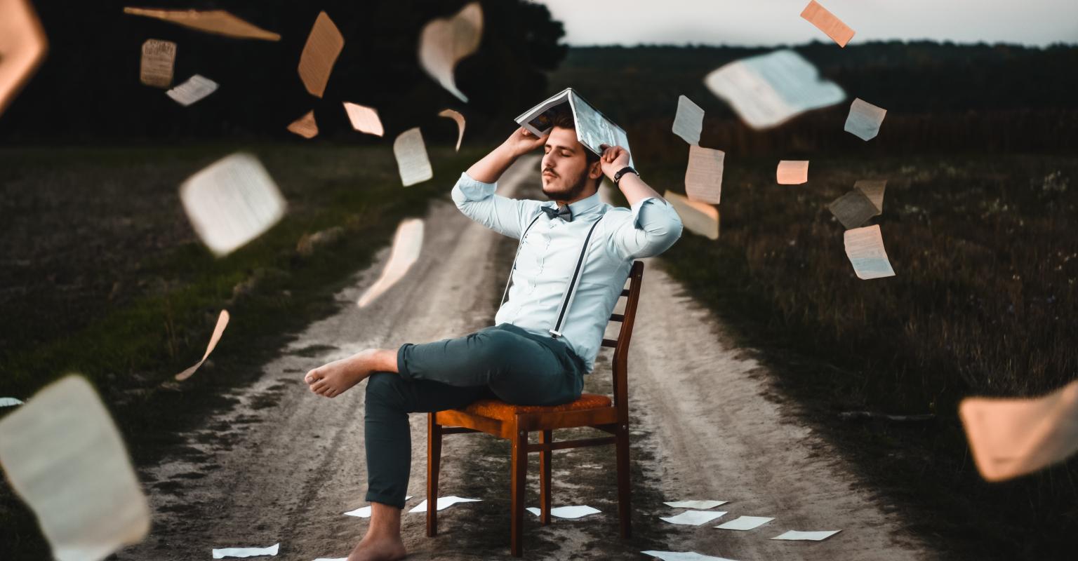 Guy with papers flying