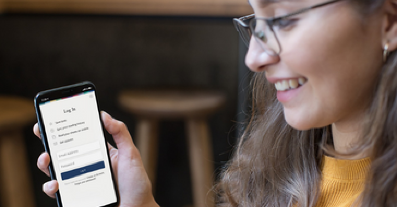 A woman demonstrates how to use the Sefaria App