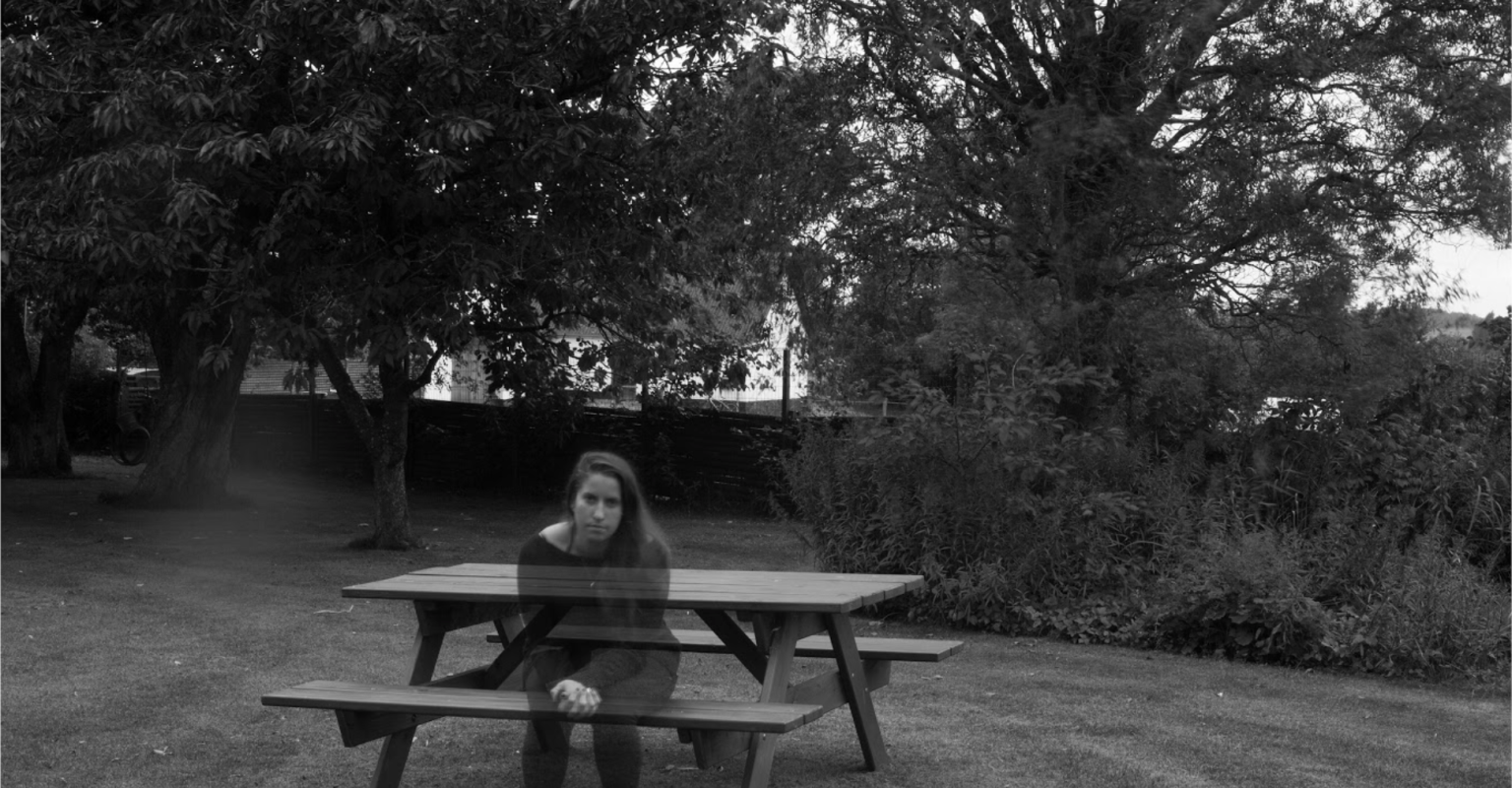 Woman sitting at a bench