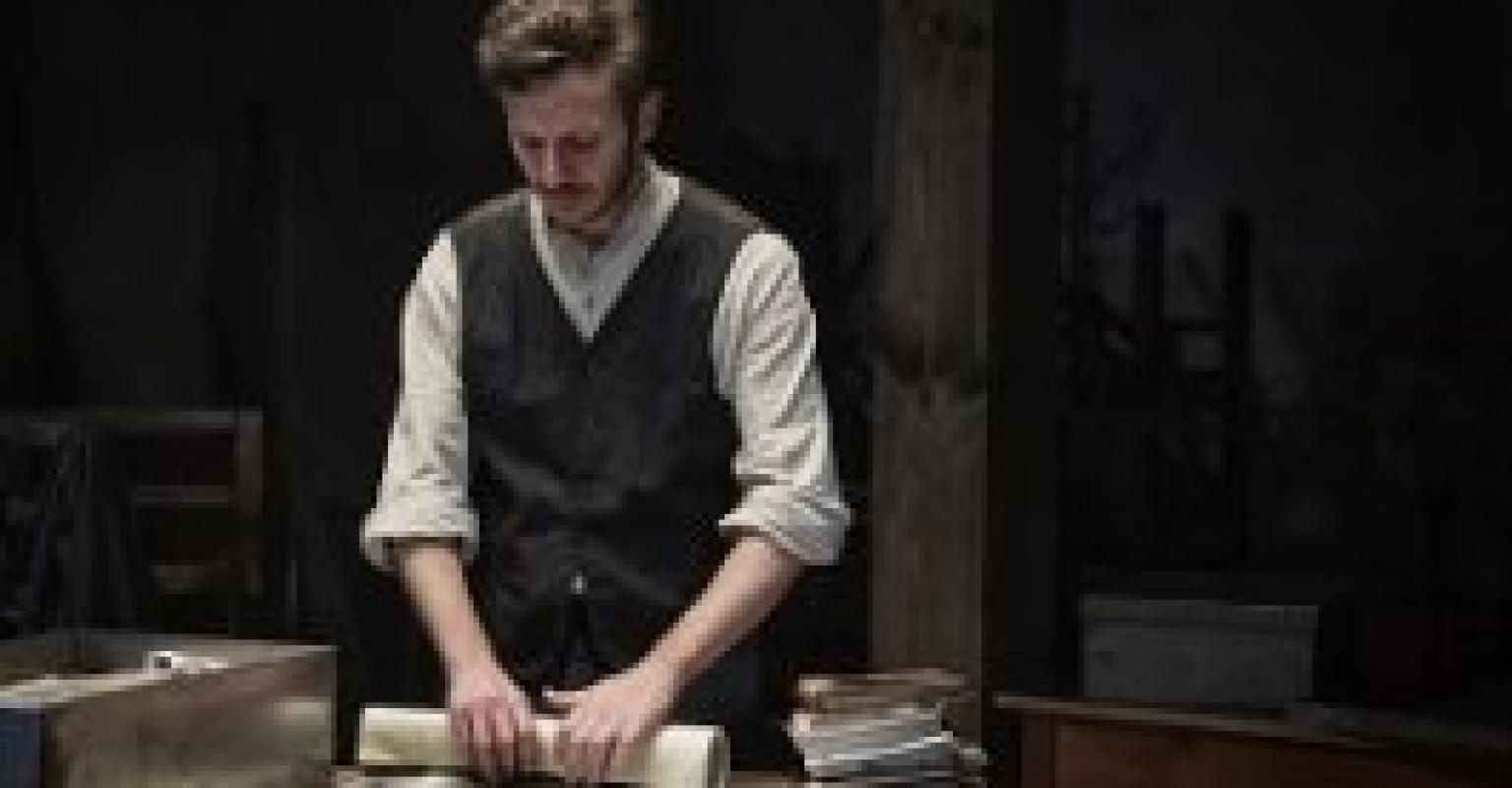 Man holding a scroll