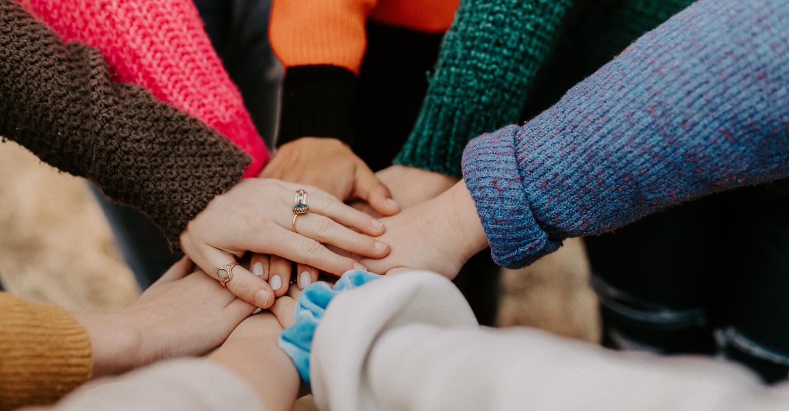 Students hands together