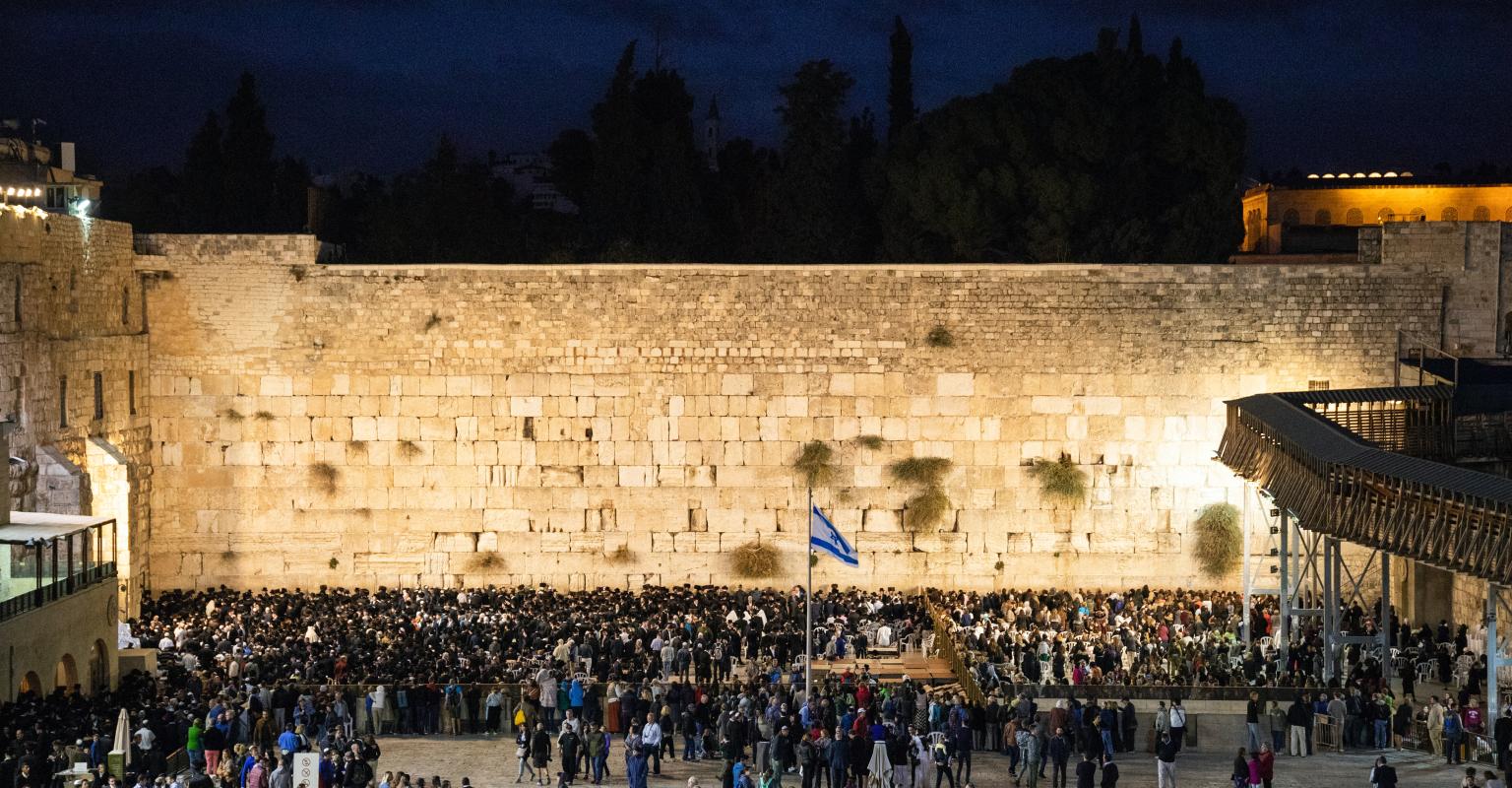 The Western wall during prayer at night
