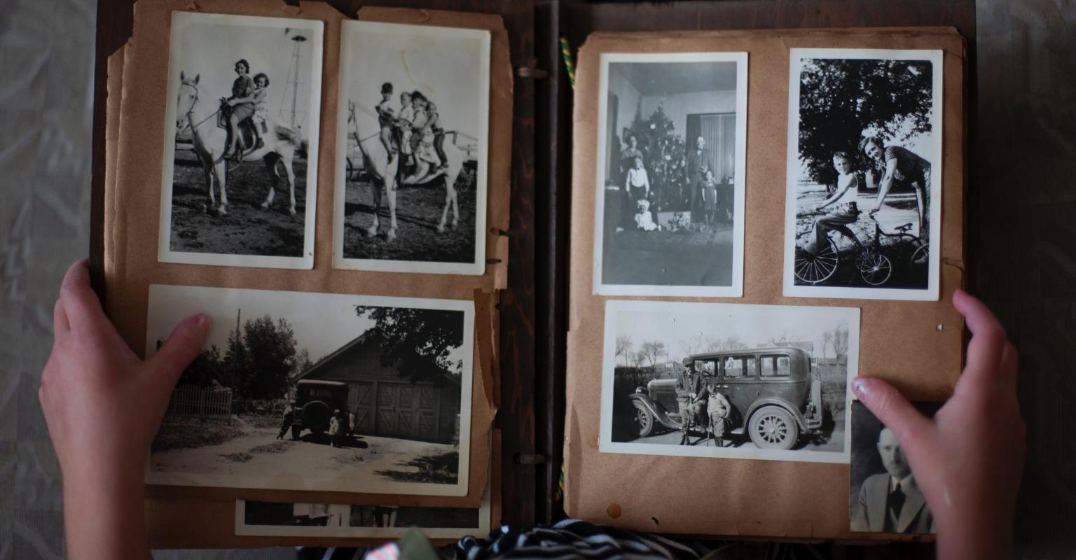 Person looking through old photo album