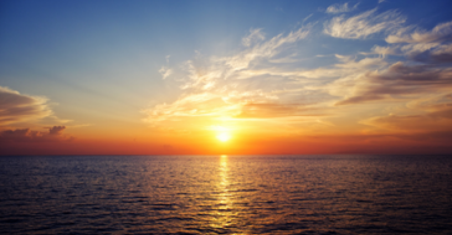 A sunrise over the water