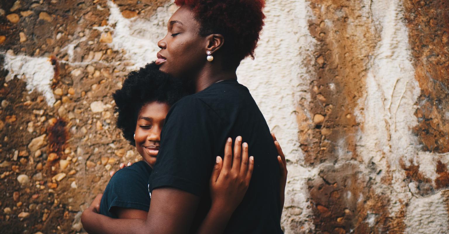 two teens hugging