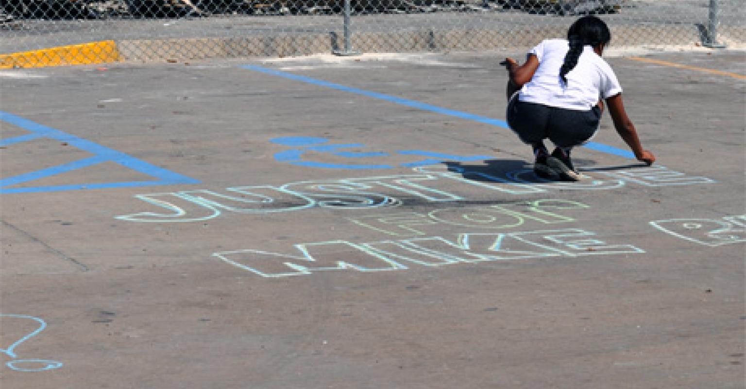 Girl writing in chalk