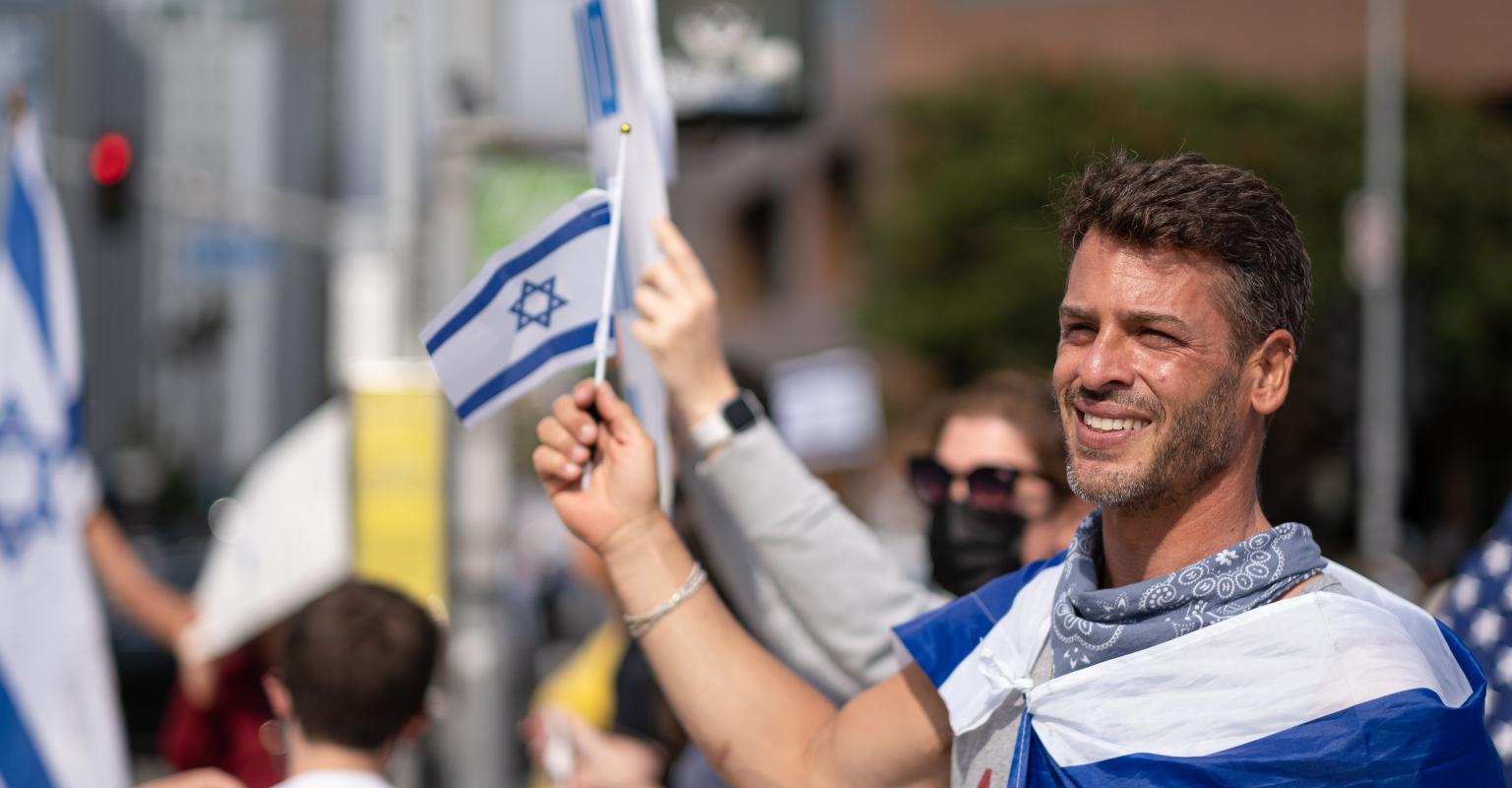 Man with flag of Israel