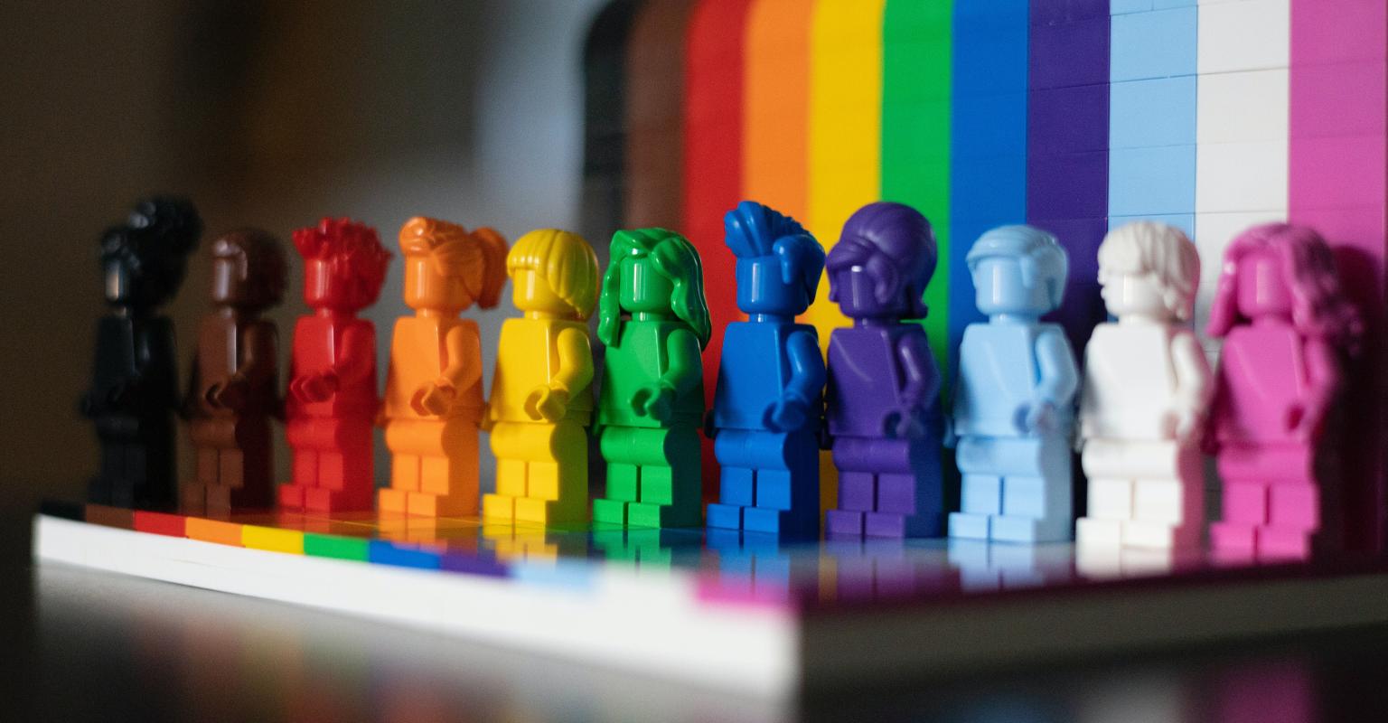 figures in colors of the rainbow
