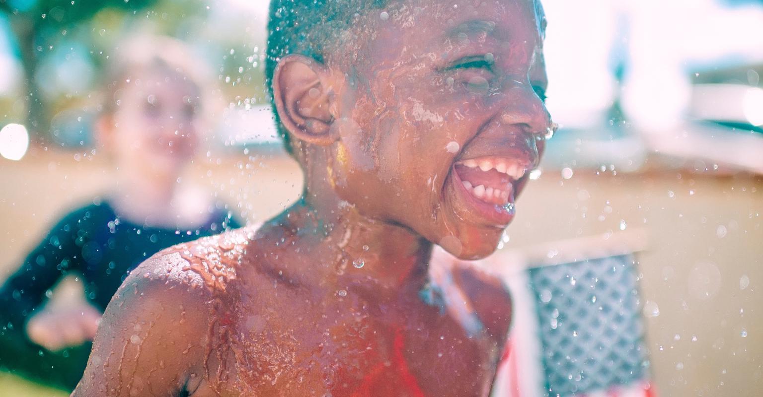 Young child with USA flag in the background