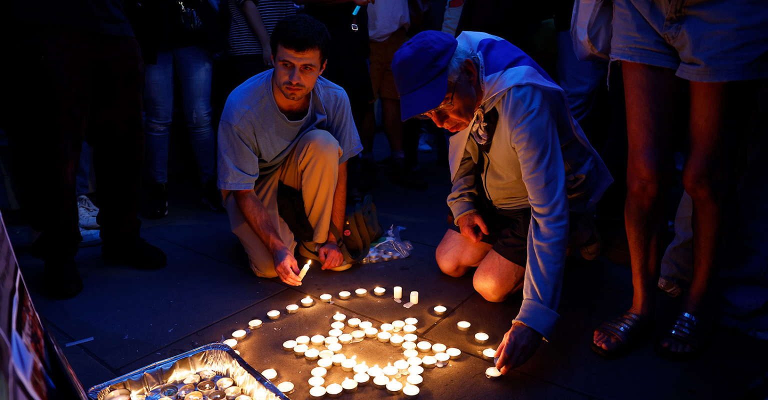 Community vigil with star of David