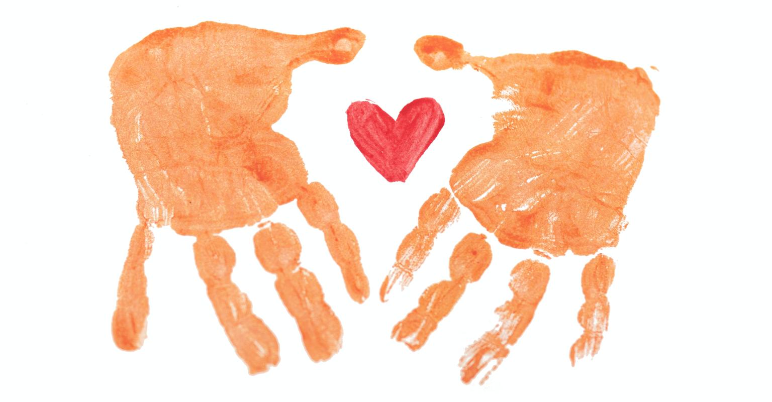 Painted handprints with a painted heart between them