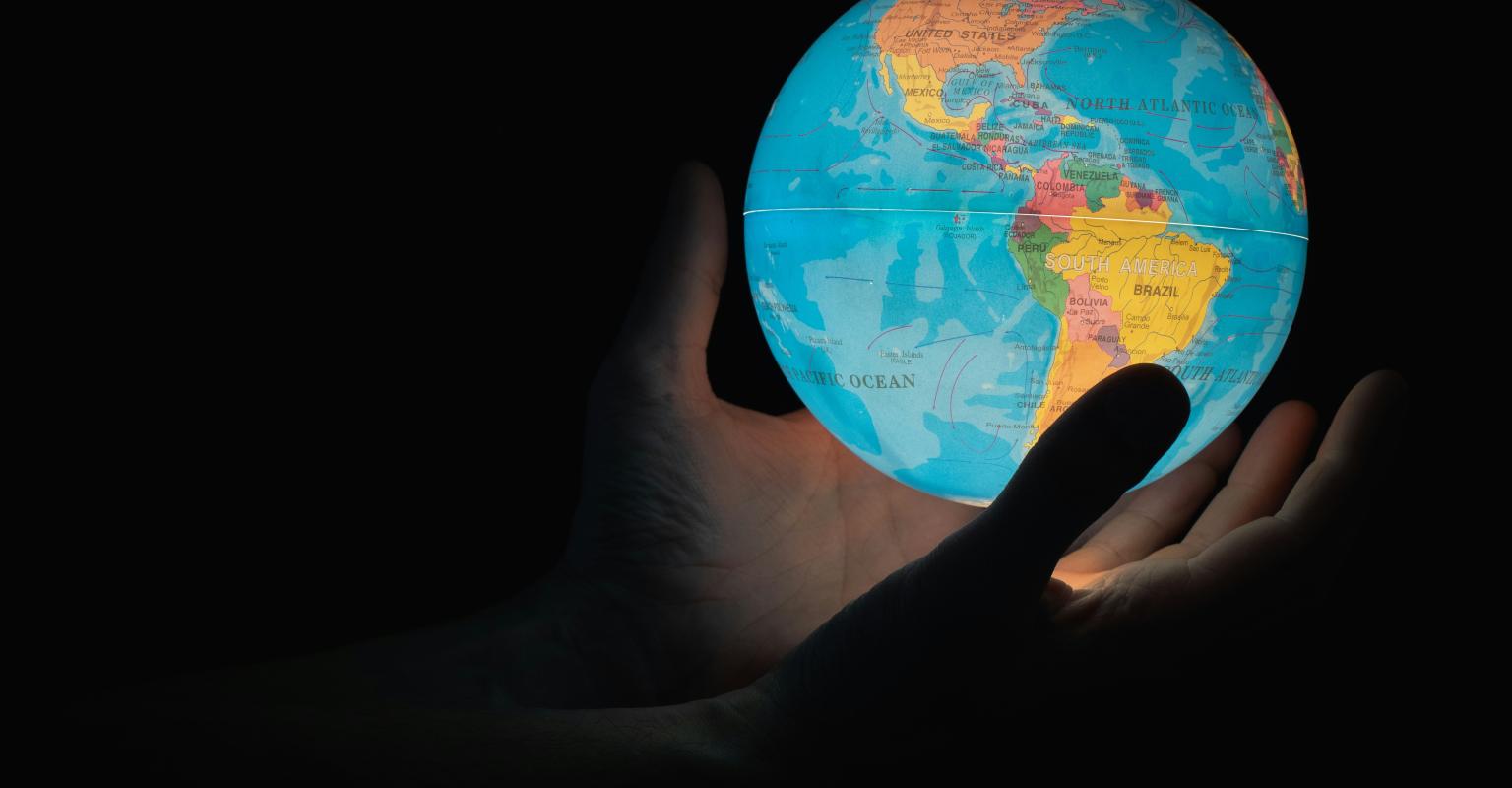 Hands holding world