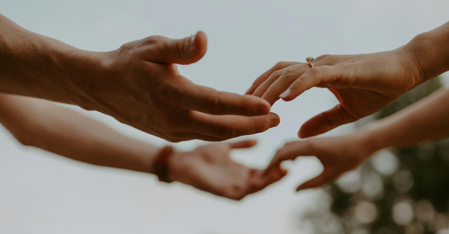 Hands reaching out to hands