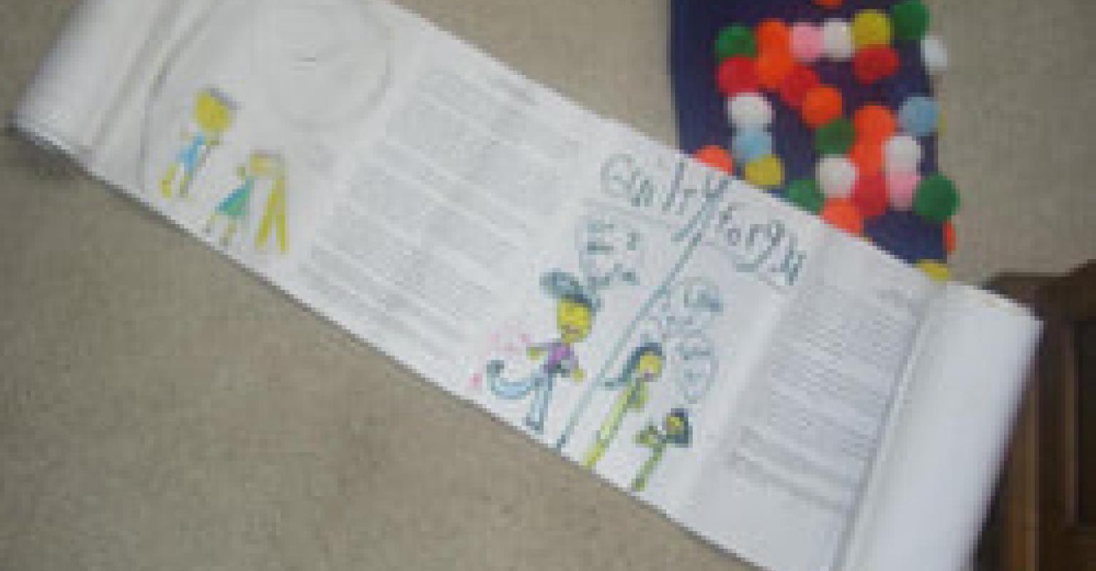 Paper Scroll Rolled Out Showing Taped Text and Illustration