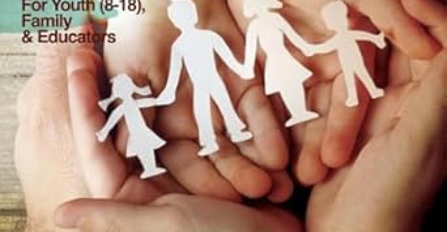 The cover of the curriculum featuring childrens hands over each others, holding a family made out of paper