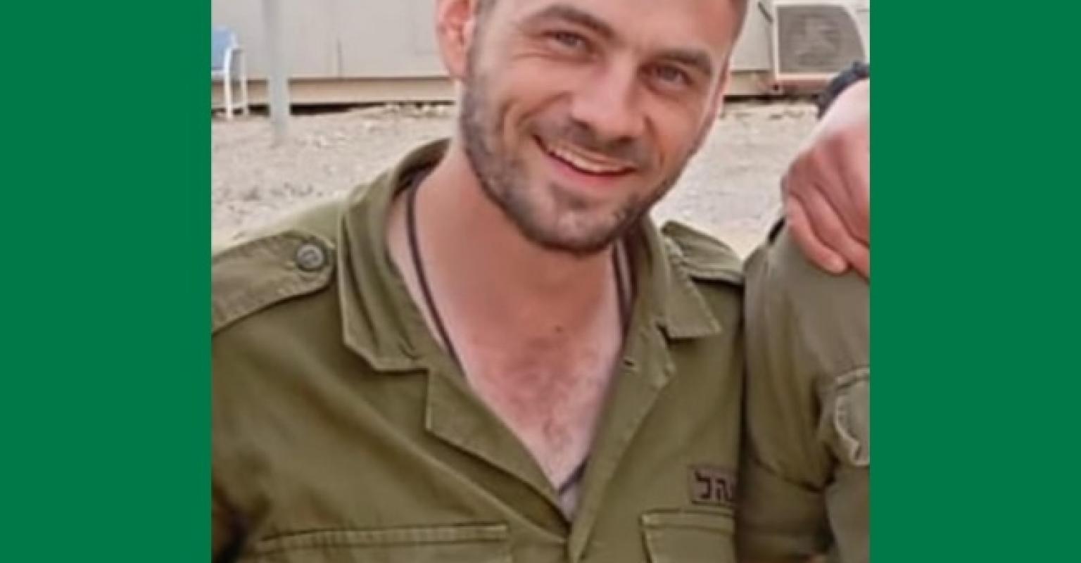 Close up image of male Israeli soldier smiling