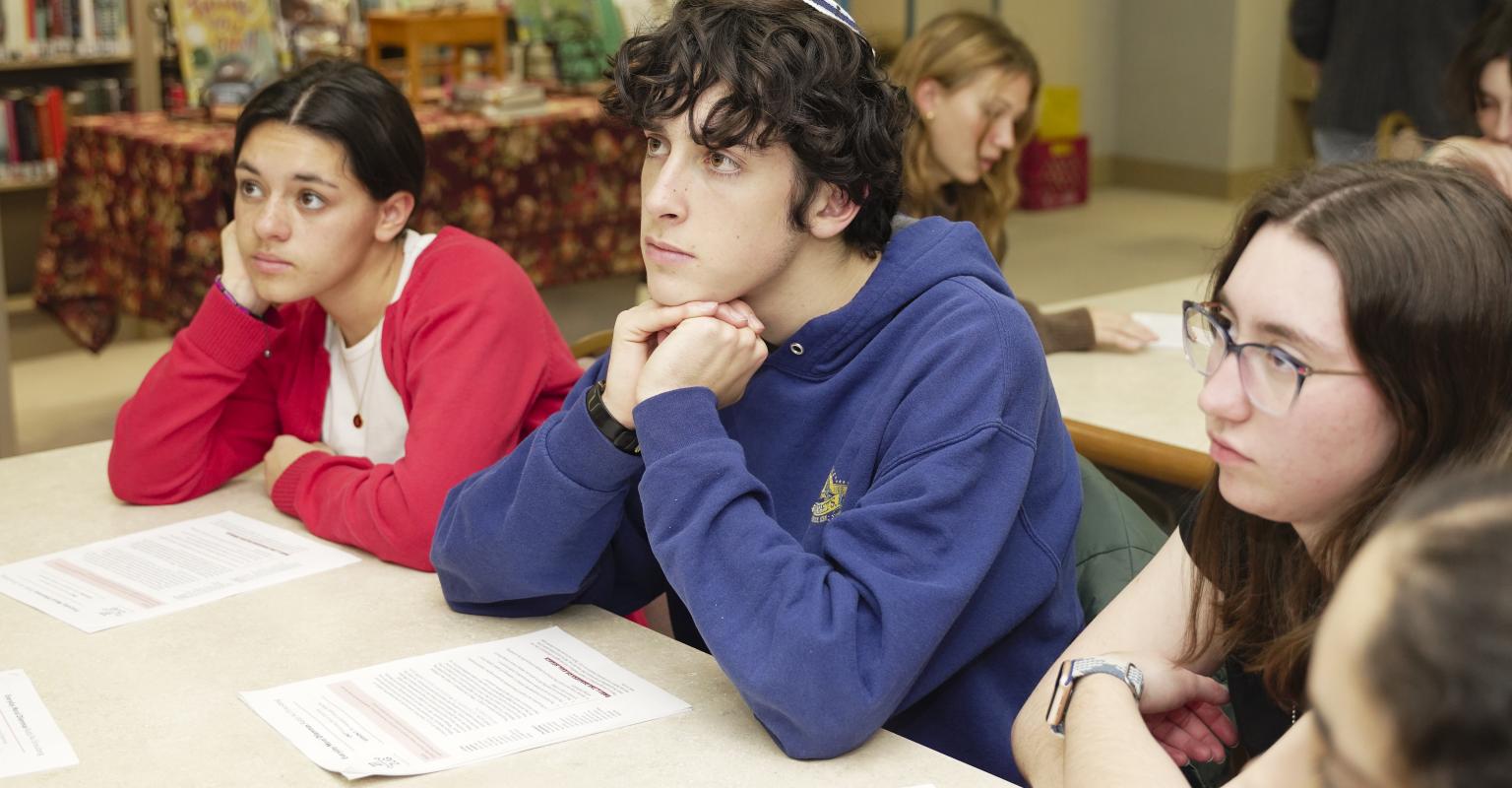 Students studying off of a source sheet.