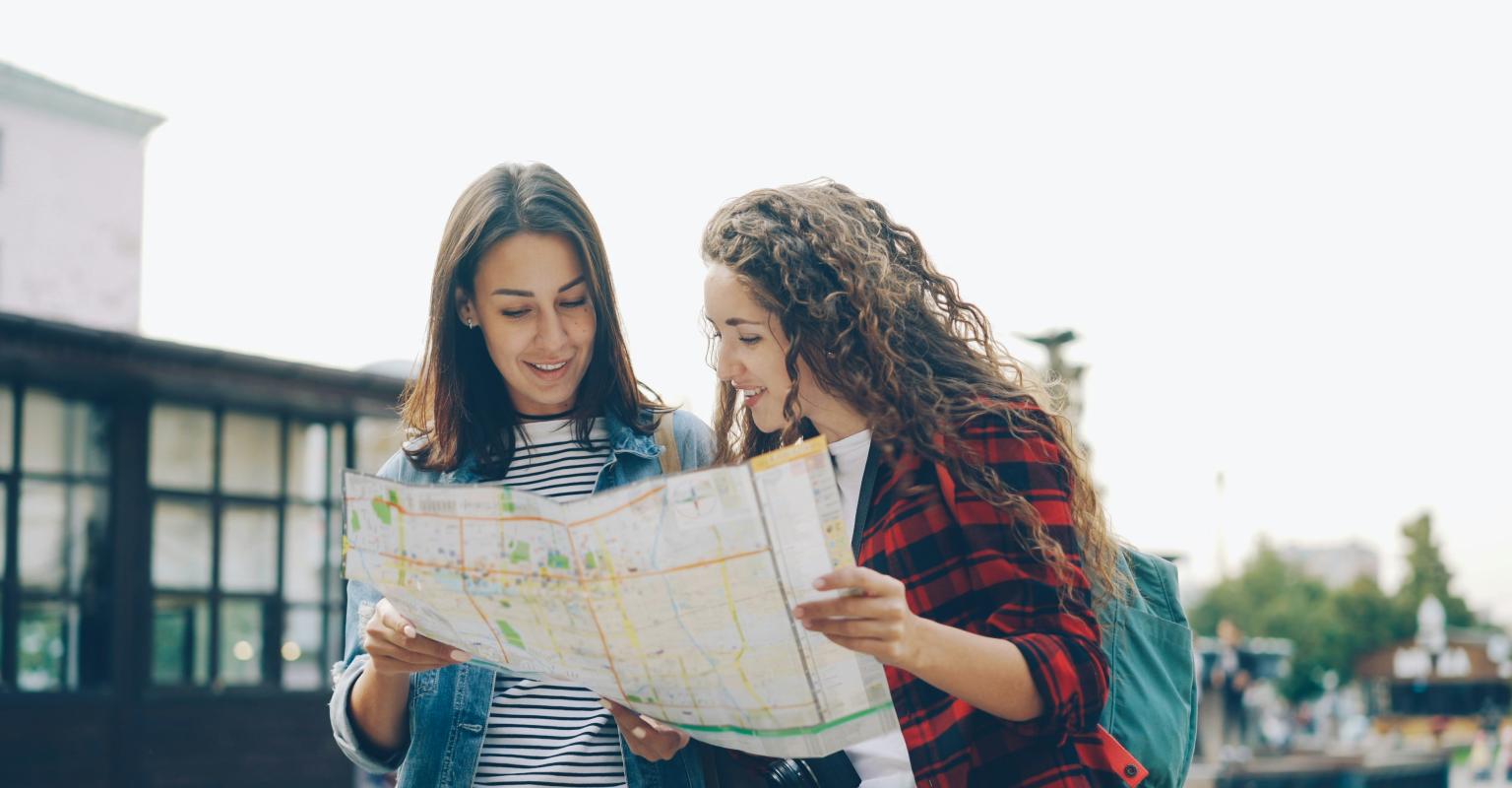 two people looking at a map