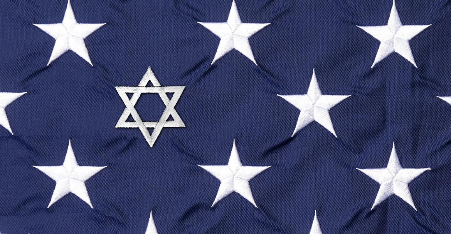 Embroidered stars on the American Flag. One star is replaced with the Magen David