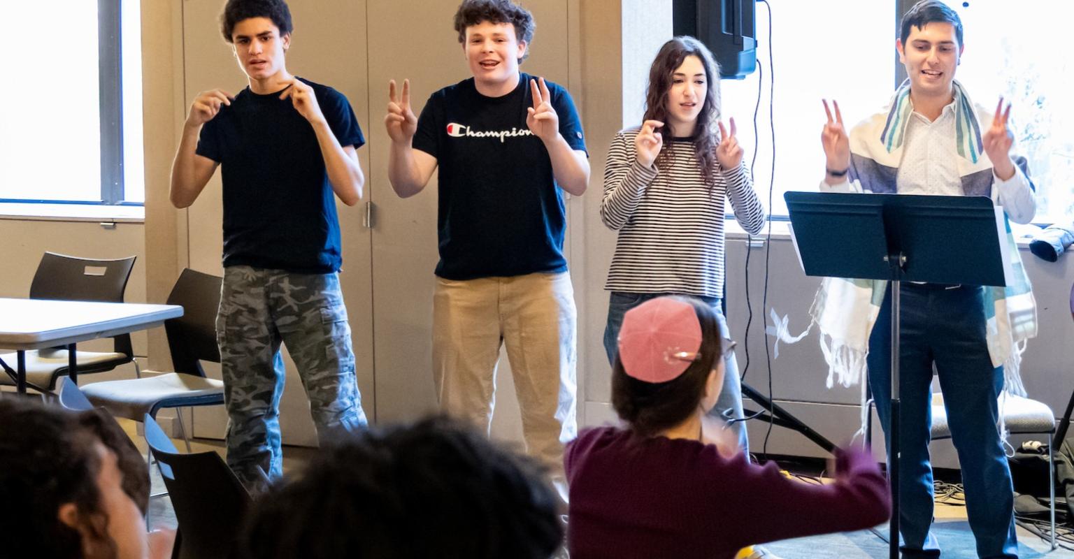Jewish Preteens performing song and dance to an audience