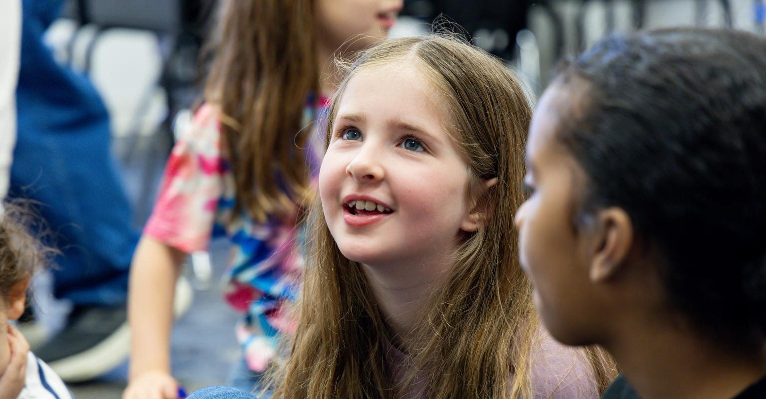 a little girl looking up