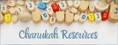 Chanukah resources written below dreidels
