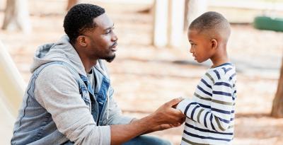 Dad talking to son
