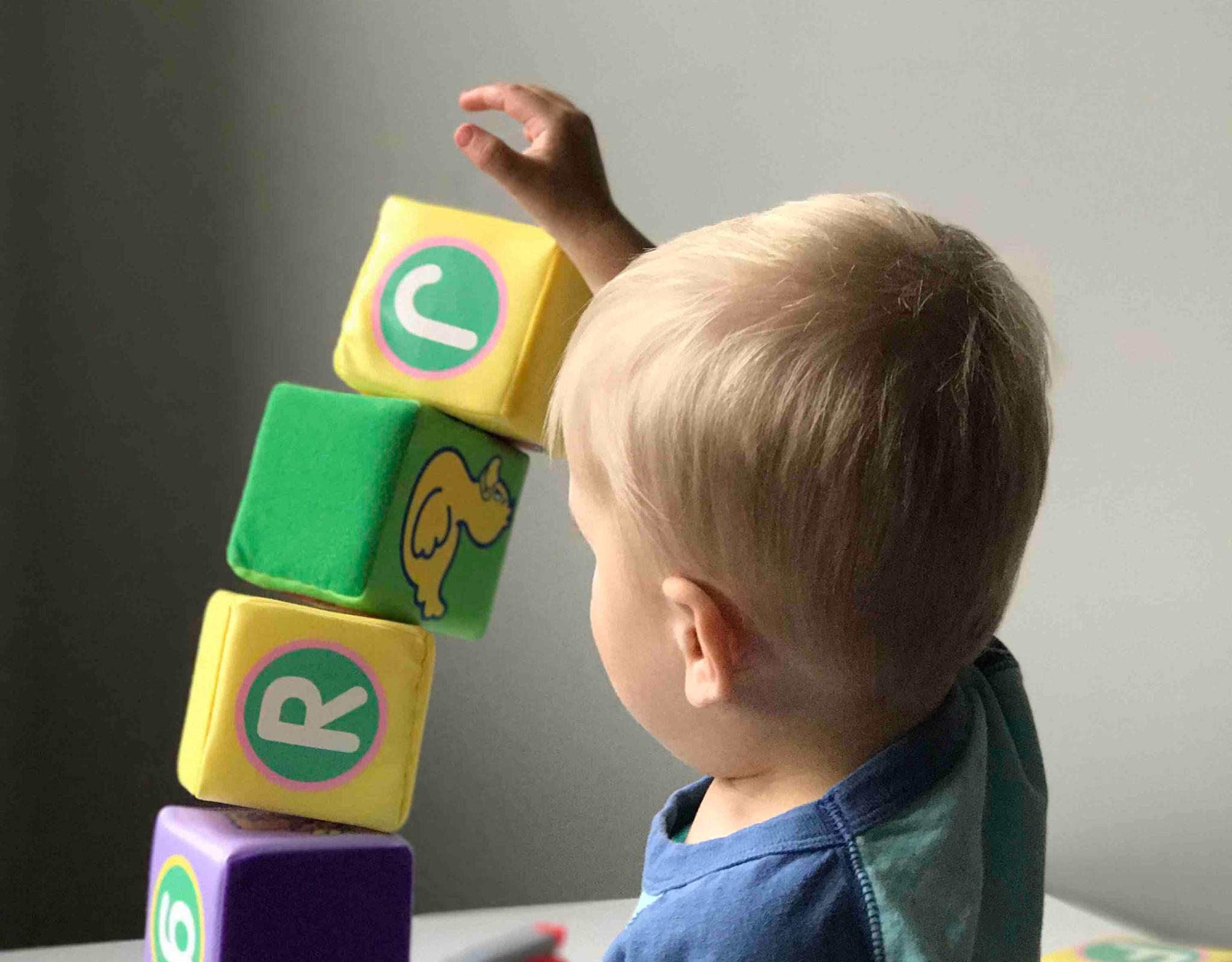 Child building a tower with blocks