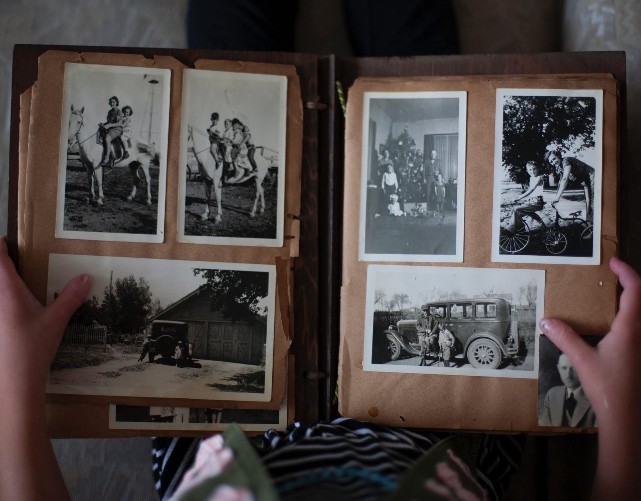 Person looking through old photo album