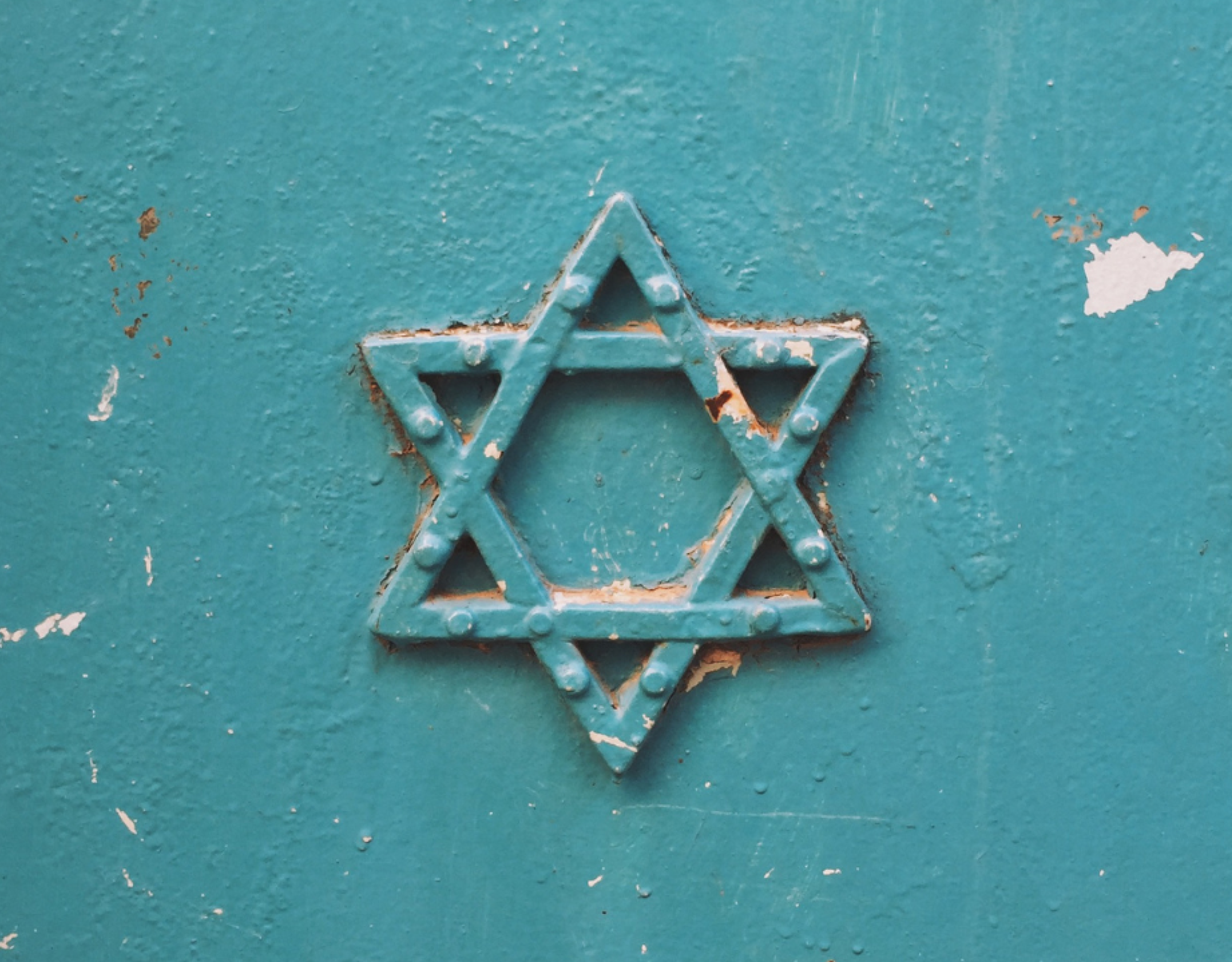 Star of David against a teal background